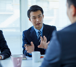 Armani Funding specialist discussing a case with a client
